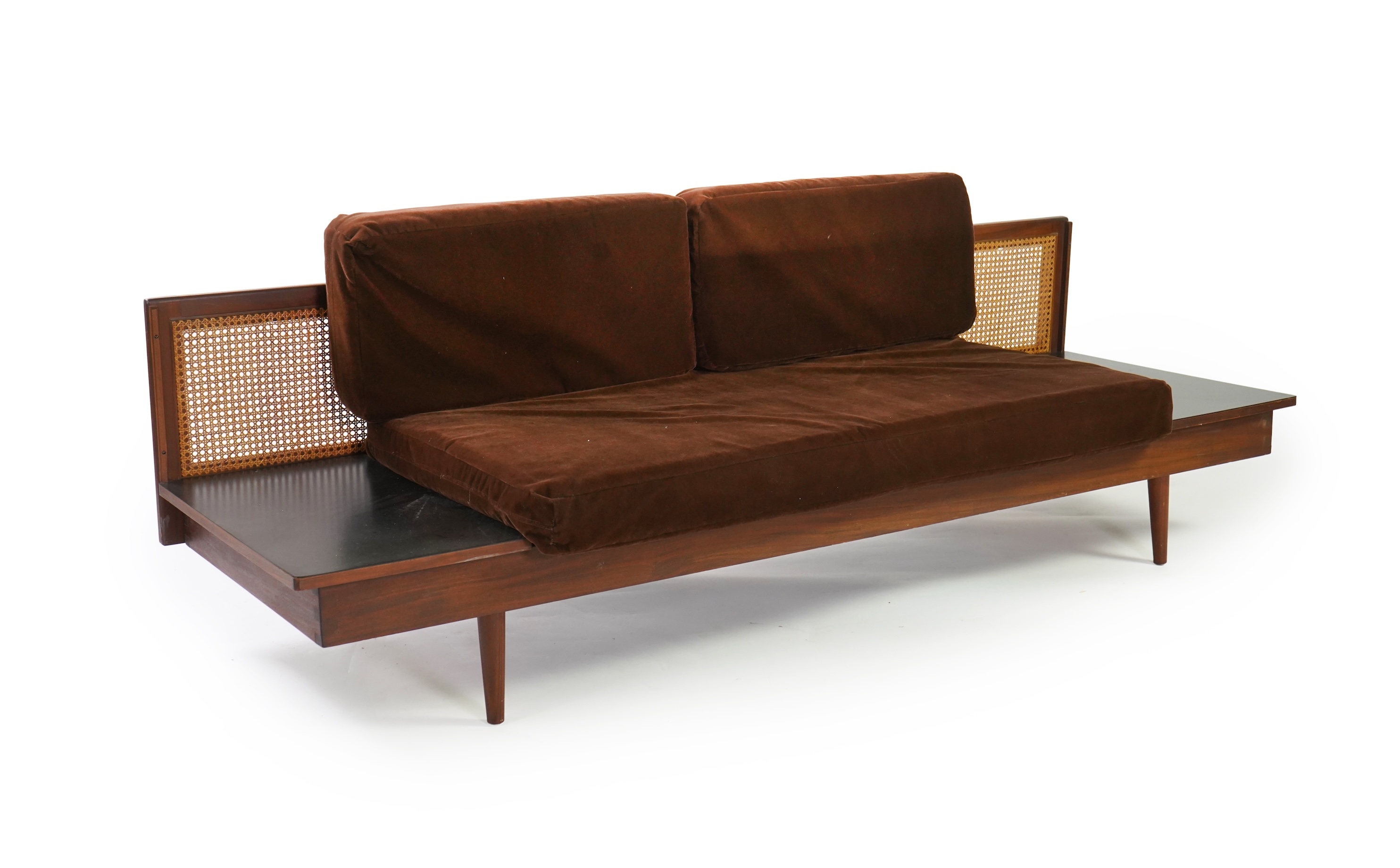 Dennis Young (British): A caned teak sofa/daybed